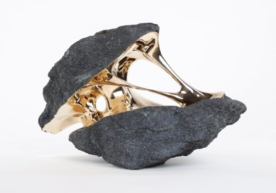 Gravity: boulder-like sculpture with golden polished bronze Interior by Romain Langlois