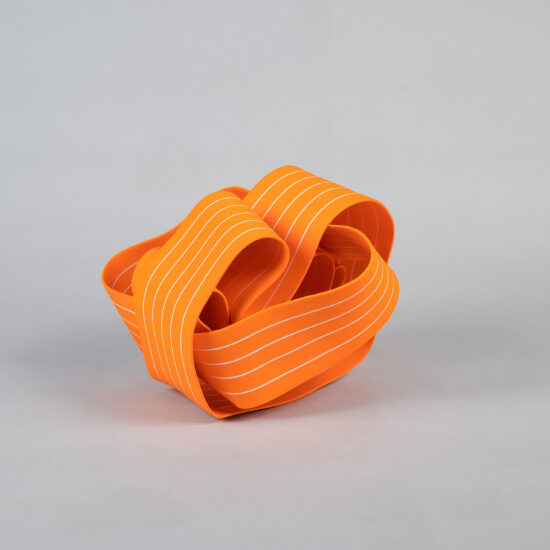 Entrapped 3: ribbon-like ceramic sculpture by Simcha Even-Chen made with paper porcelain painted in orange with white stripes.
