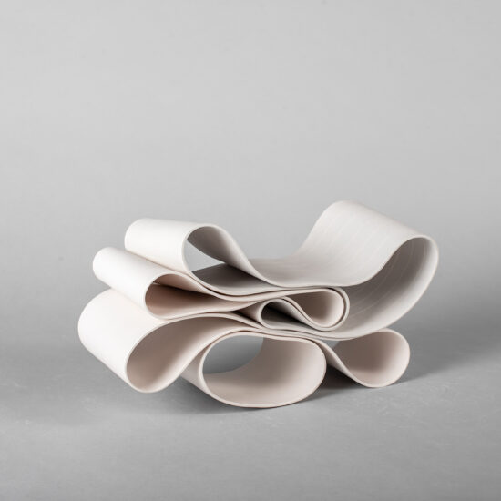 Folding in motion 10: ribbon-like ceramic sculpture by Simcha Even-Chen composed of two intertwined parts, each made with paper porcelain. One white and the other one painted in light grey with white stripes.