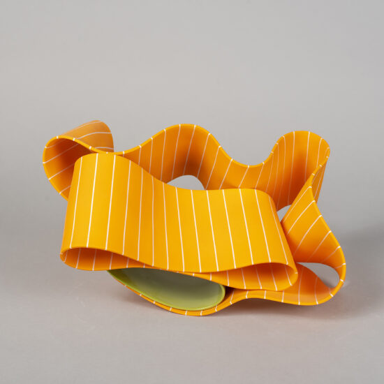 Folding in motion 6: ribbon-like ceramic sculpture by Simcha Even-Chen composed of two intertwined parts, each made with paper porcelain. One part is painted in lime-green and the other one in orange with white stripes.